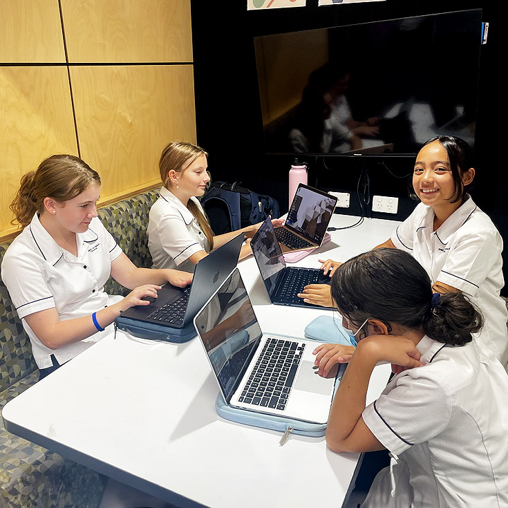 Emmaus Catholic College Kemps Creek girls collaborating in a break out booth